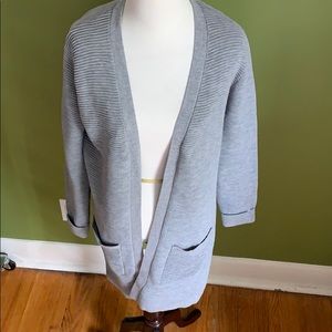 Long cardigan with pockets. Acrylic cotton blend.